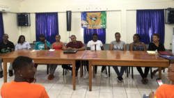 Roney Small, at microphone, and his executive.