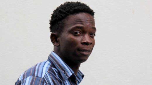 Akeemo George on his way to prison after his court appearance. (iWN photo)