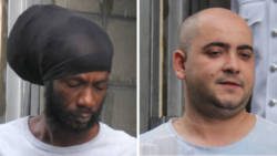 Jamaican Christopher Cole, left, and Bulgarian Mirolav Stanoev leave the SErious Offences COurt on Thursday after their sentencing. (iWN photo)