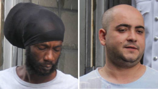 Jamaican Christopher Cole, left, and Bulgarian Mirolav Stanoev leave the SErious Offences COurt on Thursday after their sentencing. (iWN photo)