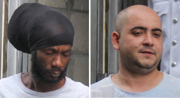 Jamaican Christopher Cole, left, and Bulgarian Mirolav Stanoev leave the SErious Offences COurt on Thursday after their sentencing. (iWN photo)