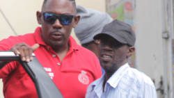 Detective Sergeant Biorn Duncan, left, escorts Louie Cupid, to the Serious Offences Court in October 2019. (iWN photo)