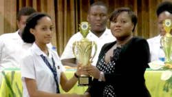 Champion public speaker  Rishona James receives her trophy. 
