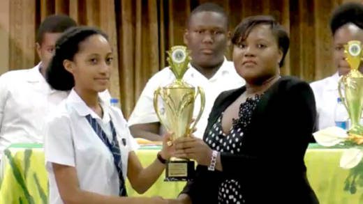 Champion public speaker  Rishona James receives her trophy. 