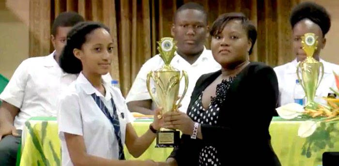Champion public speaker  Rishona James receives her trophy. 