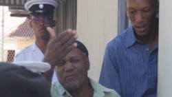 Joel Payne, left, and Jessie St. Cyr are escorted from the Serious Offences Court and taken to prison, on Tuesday, pending the payment of the fine. (iWN photo)