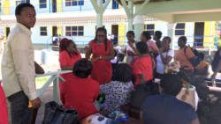 President of the SVG Teacher Union, Wendy Bynoe speaks with teachers at the Questelles Government School on Monday. (iWN photo)