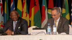 In-coming ACP Secretary-General Georges Rebelo Chikoti, left, and the incumbent Patrick I. Gomes. (CMC Photo)