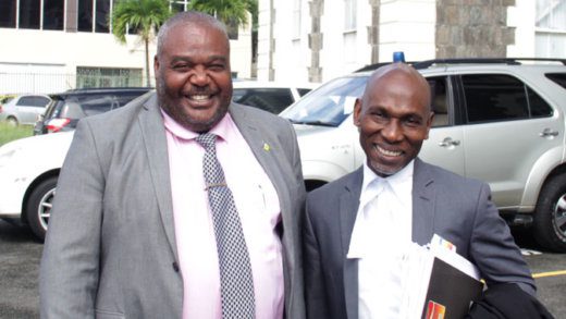Defence counsel Jomo Thomas, right, shares a light moment with detective Assistant Superintendent of Police Trevor "Buju" Bailey after the sitting of the High Court on Friday, Dec. 13, 2019. 

Bailey was the lead investigator into the Aug. 14, 2011 murder of Stephanie Daniel, and the attempted murder of Vasilsa Maloney, both of Greiggs. Thomas’ client, Aubrey Wilson was on Friday sentenced to 38 years in jail for those crimes. (iWN photo) 