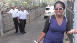 The accused, Eunice Dowers, leaves the Serious Offences Court in January 2020. In the background are Bertille "Silky" Da Silva, left, owner of Star Garage, and the company's manager, Joshua Da Silva. (iWN photo)