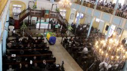 The flag-draped casket inside a packed Kingstown Methodist Church. (iWN photo)