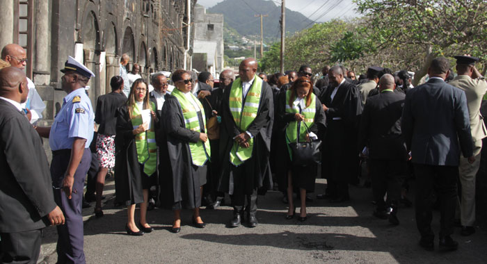 Judges and other officers of the court outside the Cathedral of the Assumption after the church service Monday morning. (iWN photo)