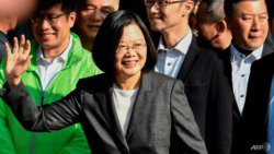 Taiwan President Tsai Ing-wen, centre, waves after voting at a polling station in New Taipei City, on Saturday, when she was elected to a second term in office. (Photo: AFP/Sam Yeh)