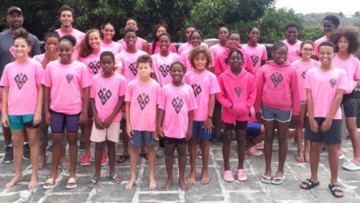 Black Sands Swim Squad and their coach, Kyle Dougan.