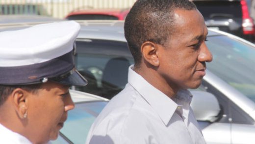 Lionel Hoyte, right, is escorted back to prison after pleading guilty, on Wednesday, to murder. (iWN photo)