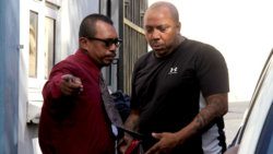 Detective Corporal May escorts the accused, Ravenol Ollivierre, left, to the Serious Offences Court on Wednesday. (iWN photo)