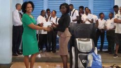 Marketing Manager of SVGTCCU Ltd., Melissa Yorke-Nicholls makes a presentation to the Secretary of the Georgetown Secondary Schools’ Cricket Team, Ms Jackson.
