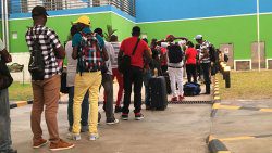 Vincentian farm workers queue up at Argyle International Airport for their flight to Canada in May. (iWN photo)