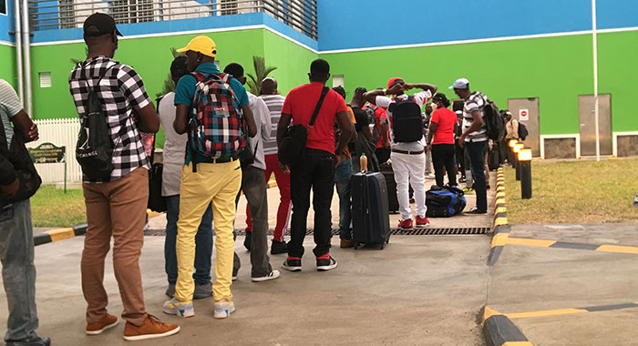 Vincentian farm workers queue up at Argyle International Airport for their flight to Canada in May. (iWN photo)