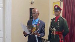 Godfred Pompey takes his oaths as head of the Constituency Boundaries Commission at Government House on Friday. (Photo: NBC Radio/Facebook)