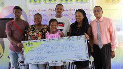 Million-dollar Lotto winner Joseph Ballantyne, centre, along with, from left, his grandson Tyrese Baptiste, his common law wife, Noreen Baptiste, granddaughter Sarai Gilbert, daughter Jolene Baptiste, and NLA General Manager, McGregor Sealey at the presentation ceremony on Tuesday. (iWN photo)