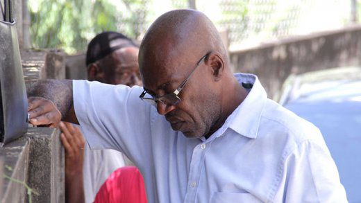 Former Star Garage employee, Marlon Stephenson waits outside the Serious Offences Court on Tuesday for his turn on the stand. (iWN photo)