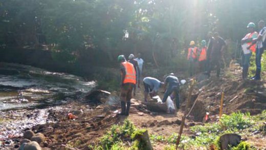 Persons at the scene in Buccament Bay, where the skeletal remains were found on Saturday.