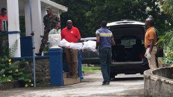 Police supervise the removal of the body on Tuesday. (iWN photo)