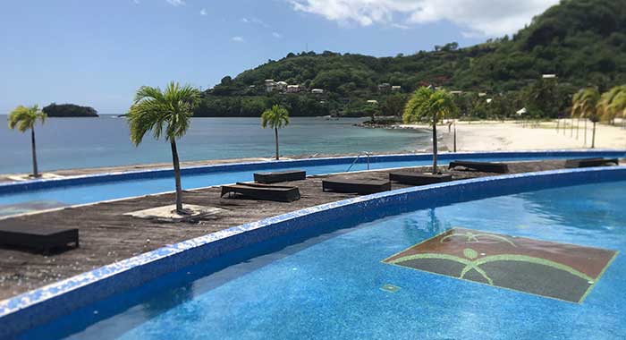 Workers at the former Buccament Bay Resort, the logo of which is seen her at a pool at the resort, are owed wages and severance pay by Harlequin, the former owners of the resort. (iWN photo)