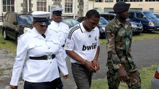 Police officers escort rapist preacher Delroy Fraser to prison to serve his 30-year sentence on Thursday. (iWN photo)