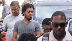 Fitzroy-Douglas, centre, pleaded guilty to stealing EC$389,155.95 from Bank of St. Vincent and the Grenadines. He is seen here, escorted by detectives, on his way to court on Monday. (iWN photo)