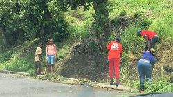 Workers on the road cleaning programme in eastern St. Vincent in 2020. (iWN photo)