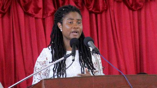 Shara Balcombe, daughter of Jerry S. George, pays tribute to him at his funeral in Kingstown on Saturday. (iWN photo)