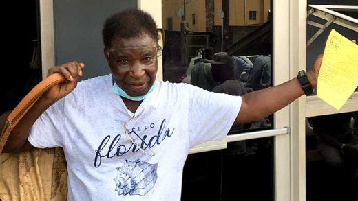 Quarantine-breaker Ivan Nathaniel Burgin, 78,  poses for journalists outside the Kingstown Magistrate's Court  after his arraignment on Thursday. (iWN photo)