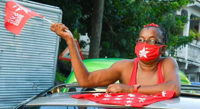 A woman wears ULP campaign paraphernalia, including a facemask, during a campaign event. (PHoto: Ralph Gonsalves/Facebook)