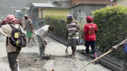 Residents of Spring Village clean up volcanic ash in their community on Sunday,April 18, 2021. (iWN photo)