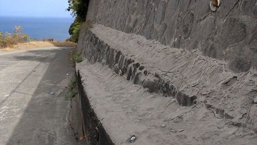 A large deposit of ash o a retaining wall near a house in Troumaca on Monday. (iWN photo)