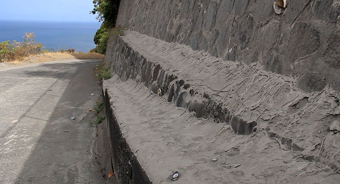 A large deposit of ash o a retaining wall near a house in Troumaca on Monday. (iWN photo)