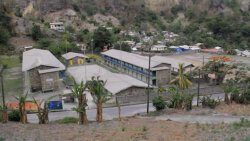 While some residents have cleaned their homes, volcanic ash in public spaces such as educational institutions and recreational areas remain a challenge in Petit Bordel. (iWN photo)