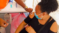 A woman receives a COVID-19 vaccine at the Calliaqua Playing Field on March 7, 2021. (Photo: SVG Health/Facebook)