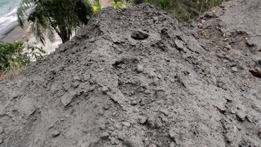 Volcanic ash at a roadside in Petit Bordel last month. (iWN photo)