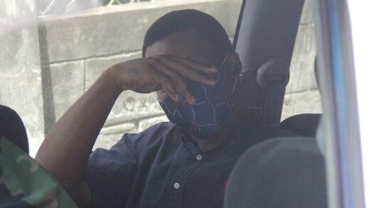 Aneil Hayzelwood sits in a police vehicle awaiting transportation to prison on Tuesday. (iWN photo)