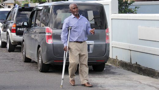 Shooting victim and threatening language accused, Cornelius John arrives at the Calliaqua Magistrate's Court on Monday. (iWN photo)