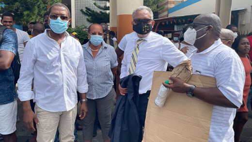 Opposition Leader Godwin Friday and other persons, including former North Leeward MP, Roland "Patel" Matthews, right, and NDP candidate in the November 2020 general elections, Ben Exeter, at a protest in Kingstown on July 6, 2023. (iWN photo)