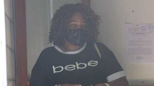 Monica Thomas leaves the Serious Offences Court on Monday after paying the fine. (iWN photo)
