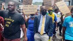 Central Kingstown MP St. Clair Leacock among protesters in Kingstown on Tuesday. (iWN photo)
