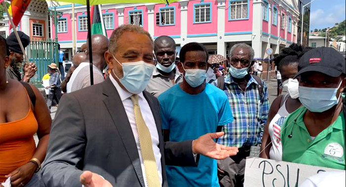 Opposition Leader Godwin Friday in conversation with protesters in Kingstown on Aug. 5, 2021. On Monday, March 13, 2023, he welcomed the High Court ruling that the government's vaccine mandate was illegal. (iWN photo)