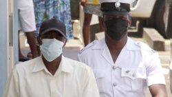 Louie Cupid in police custody outside the Serious Offences Court on Tuesday. (iWN photo)
