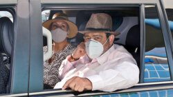 Prime Minister Ralph Gonsalves and his wife, Eloise, in his official vehicle at AIA on Monday, after his return from Barbados. (Photo: Lance Neverson/Facebook)