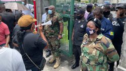 Police officers and protesters outside. the Parliament compound on Aug. 5. 